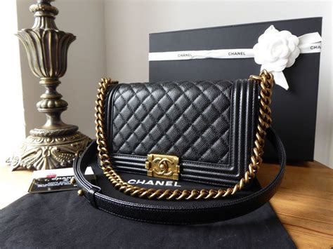 black gold chanel boy